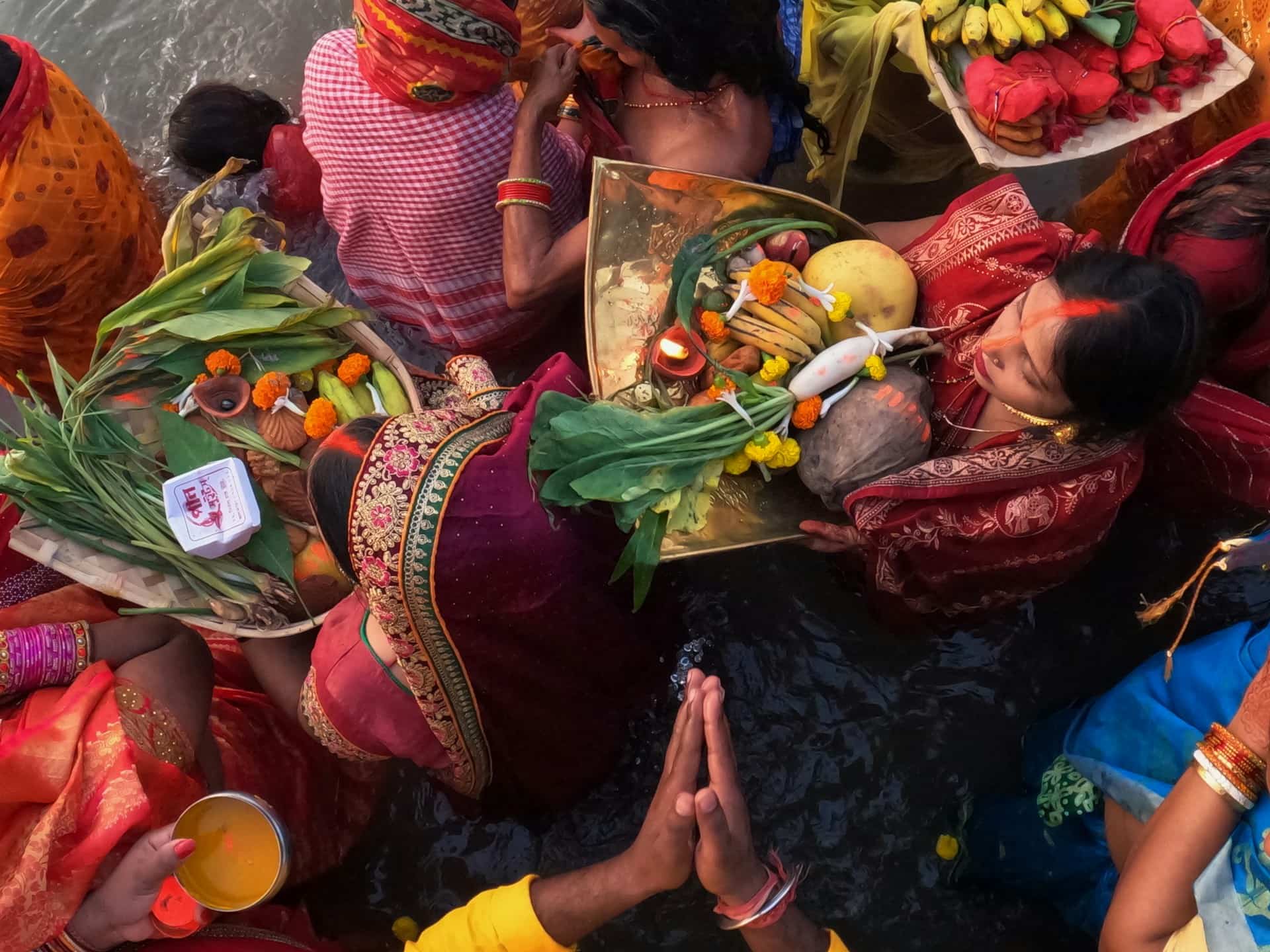 Women Celebrating with Fruits on Trays